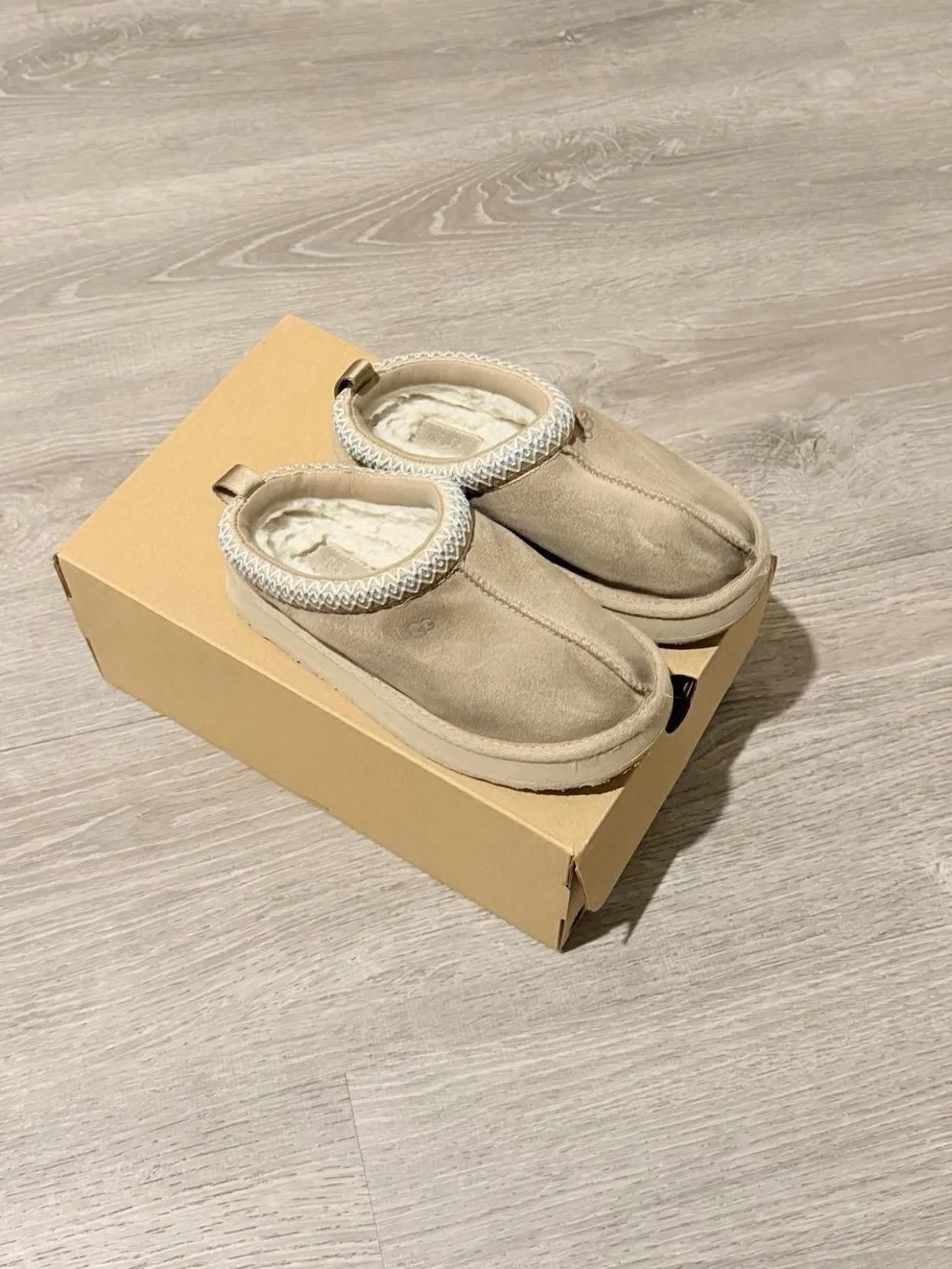 UGG Kids Slip-On Cozy Shearling Lined Slippers in Chestnut Tan